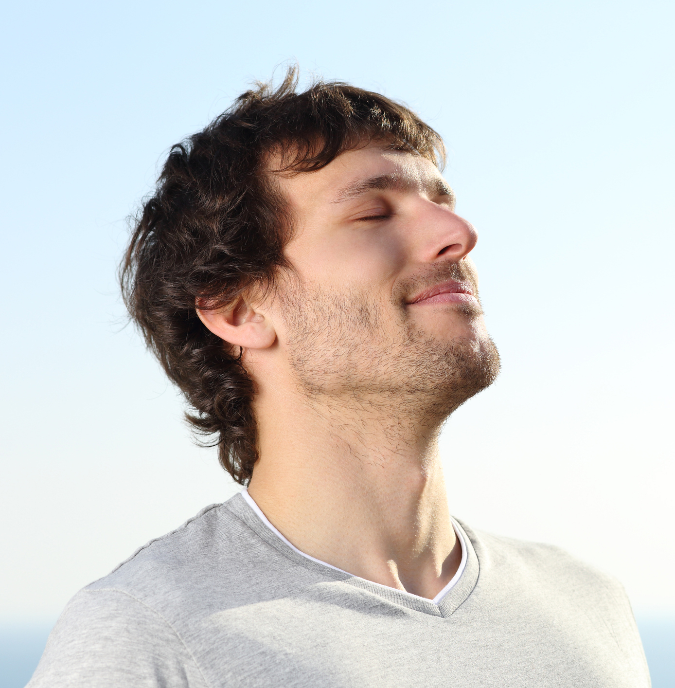 Close up of a man doing breath exercises outdoor Revision Rhinoplasty in Akron, OH